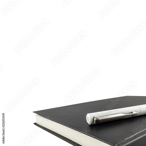 Black notebook and pen over isolated on white background