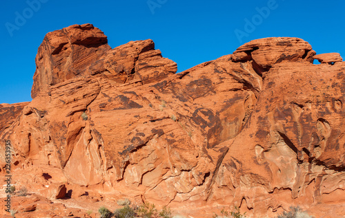 Rock formations in the Nevada desert at Valley of Fire State Park, USA. Valley of Fire State Park is the oldest state park in Nevada, USA and was designated as a National Natural Landmark in 1968.