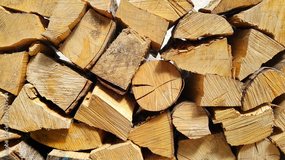 Firewood pile stacked chopped wood trunks Firewood pile stacked chopped wood trunks