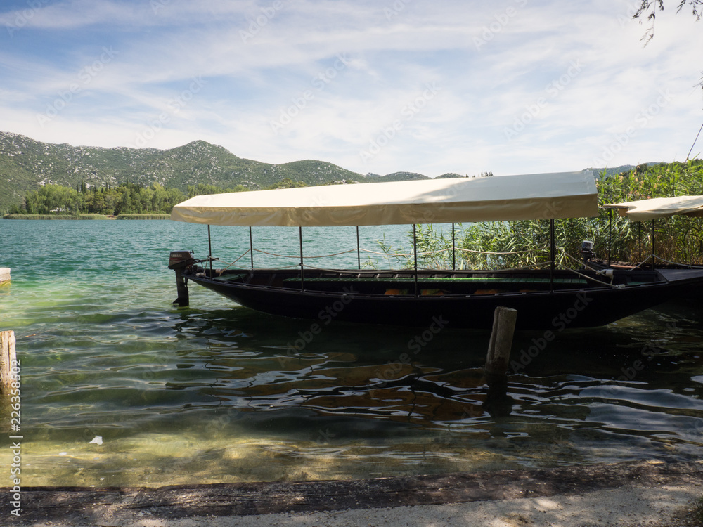 Boat at beautiful Bacina lakes in Dalmatia,Croatia - holiday destination