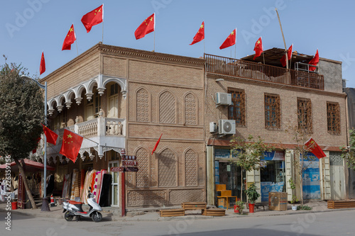 House with Chinese flags in Kashgar, Xinjiang photo