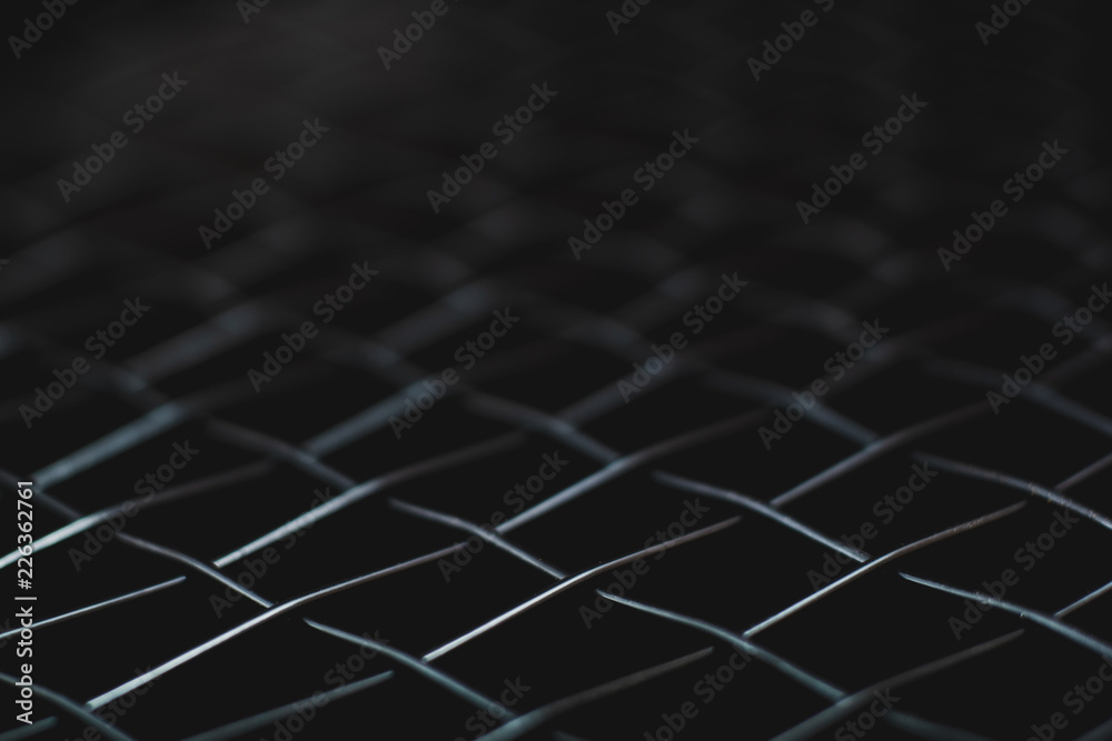 macro shot of black net tennis racket for background macro shot of black net tennis racket for background