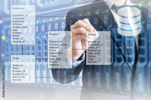 Double exposure of professional businessman system analysis design and drawing database table with futuristic background