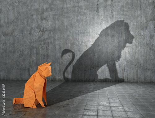 Concept of hidden potential. A paper figure of a cat that fills the shadow of a lion. 3D illustration