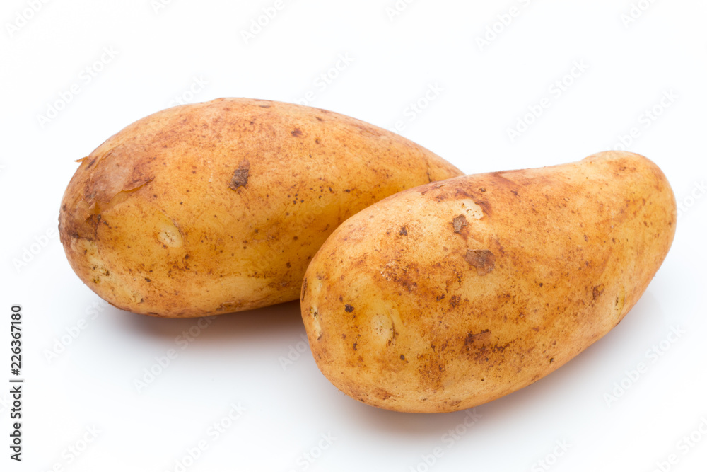A bio russet potato isolated white background. A bio russet potato isolated white background.