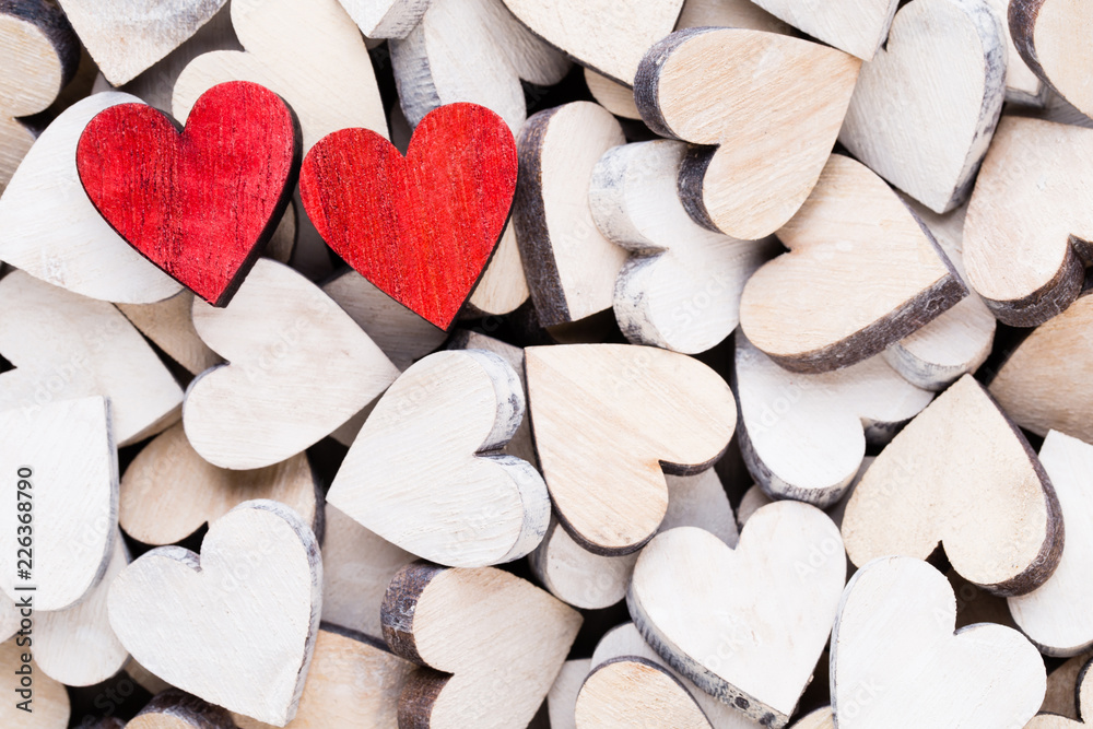 Obraz premium Background with wooden hearts, place for text.