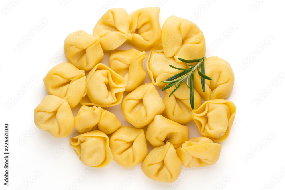 Raw homemade pasta,tortellini with herbs.