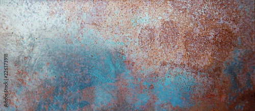 Rust metal textured wall background with scratches. Dark grunge board