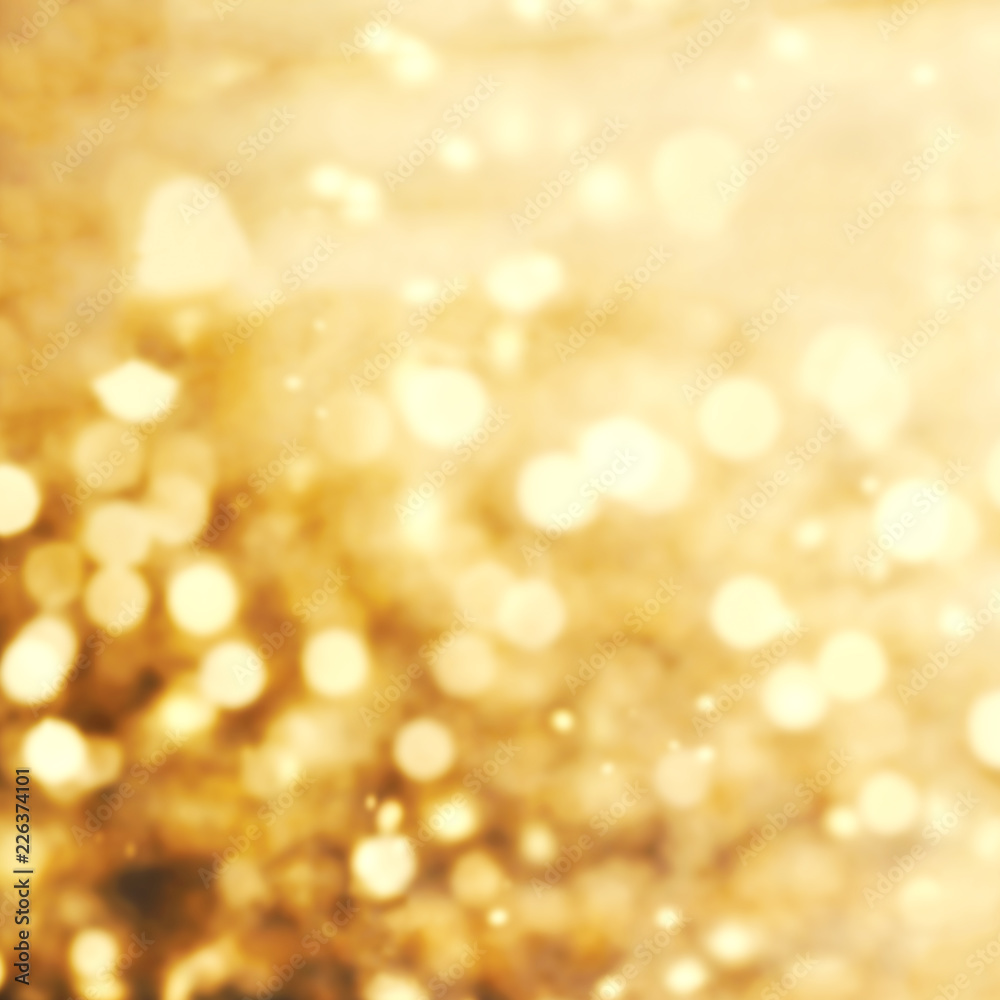 Golden blur soft abstract Christmas background with bokeh. Merry Christmas blurred beautiful shiny lights Golden blur soft abstract Christmas background with bokeh. Merry Christmas blurred beautiful shiny lights