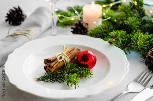 Festive place setting for christmas dinner photo