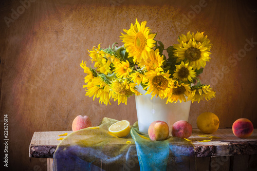 Fototapeta Naklejka Na Ścianę i Meble -  still life bouquet flower vintage art sunflowers apricot fruits