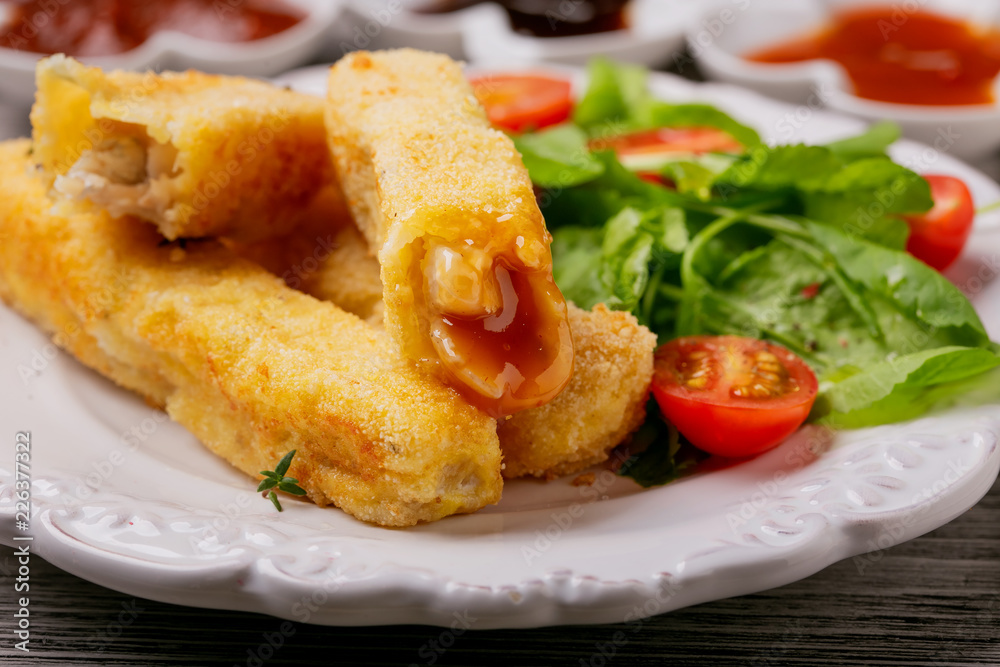 Fish sticks fried in breadcrumbs, close up Fish sticks fried in breadcrumbs, close up