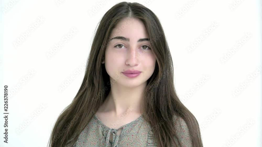 portrait of a young beautiful Caucasian girl with long hair on a white background portrait of a young beautiful Caucasian girl with long hair on a white background