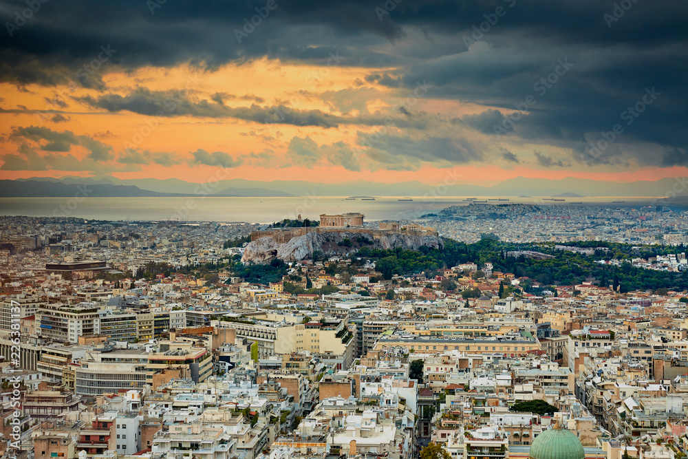 Acropolis of Athens Greece at cloudy and rainy sunset