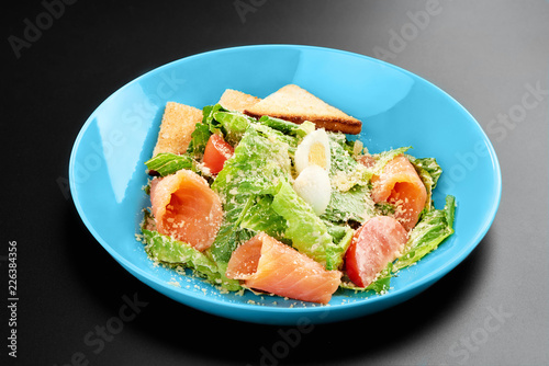 Salad tomatoes leaves salmon eggs basil Concept healthy meal black background menu restaurant