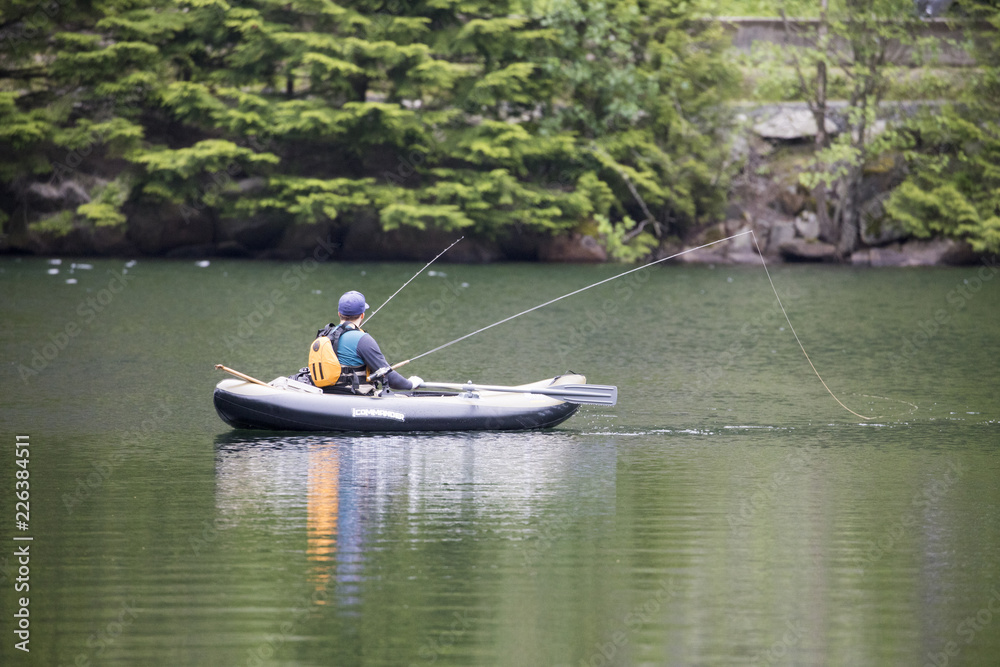 men fishing in kayak