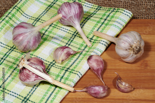 Gaplic and dish cloth on cutting board photo