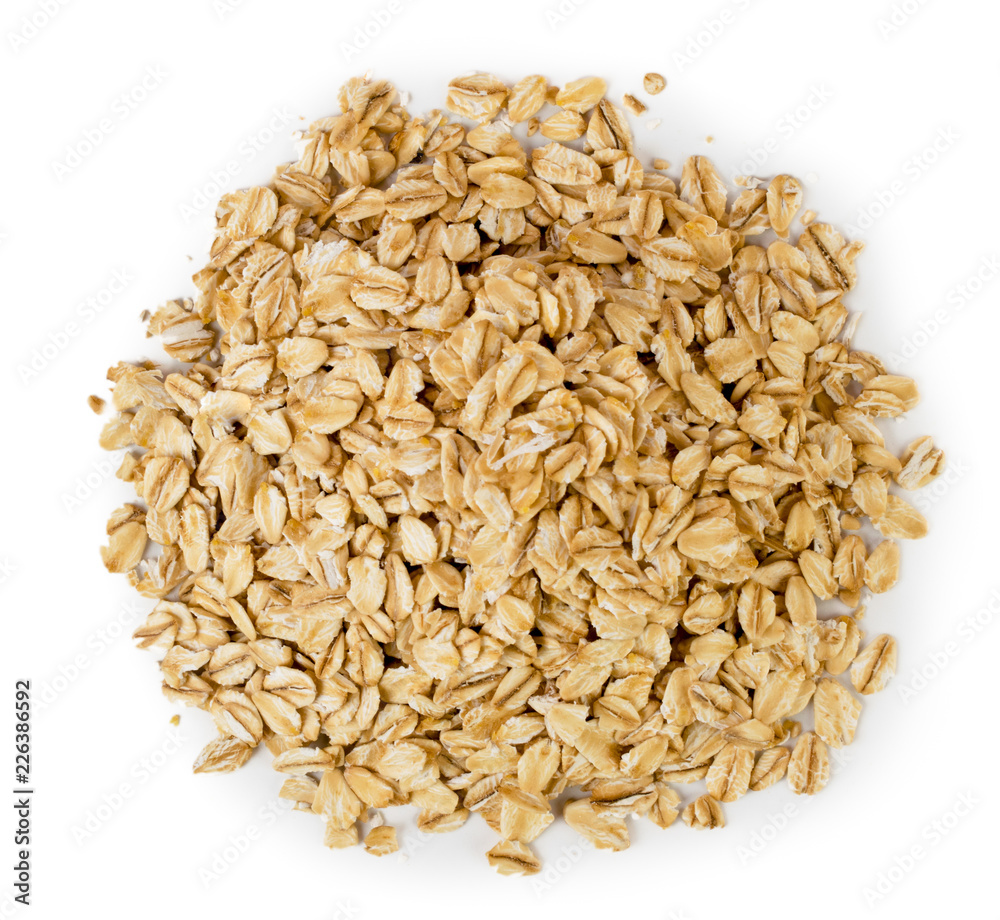 A bunch of oat cereal on a white. The view from the top. A bunch of oat cereal on a white. The view from the top.