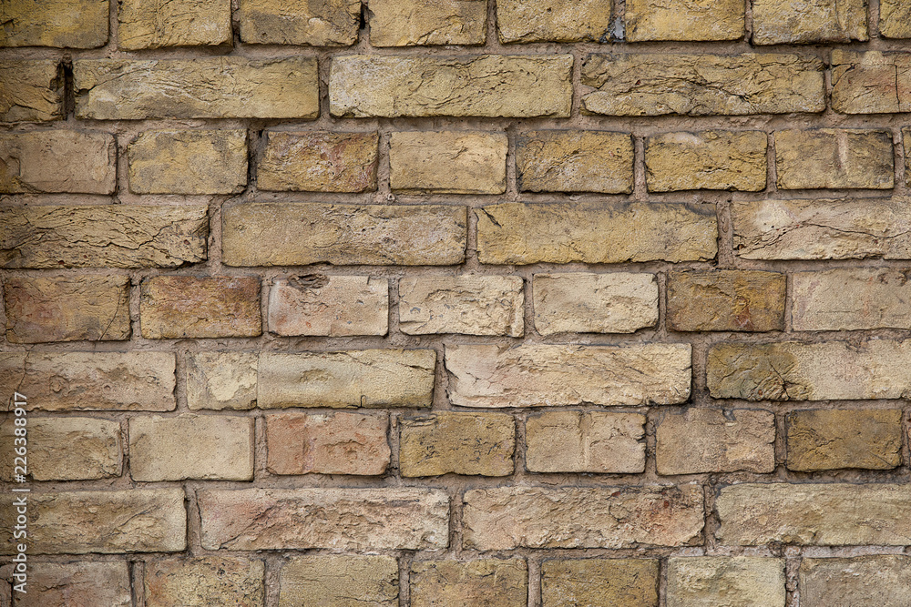 Old brown brick wall background or texture.