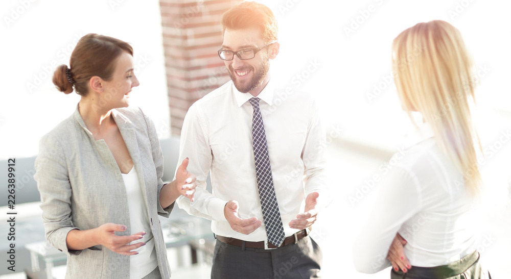 Manager and business team talking in the office. Manager and business team talking in the office.
