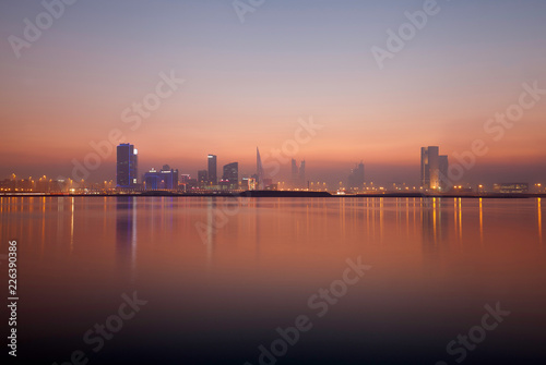 A beautiful view of Bahrain skyline during sunset photo