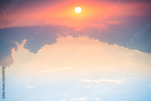 Fototapeta Naklejka Na Ścianę i Meble -  Sunset with sun and clouds on blue and orange dramatic sky