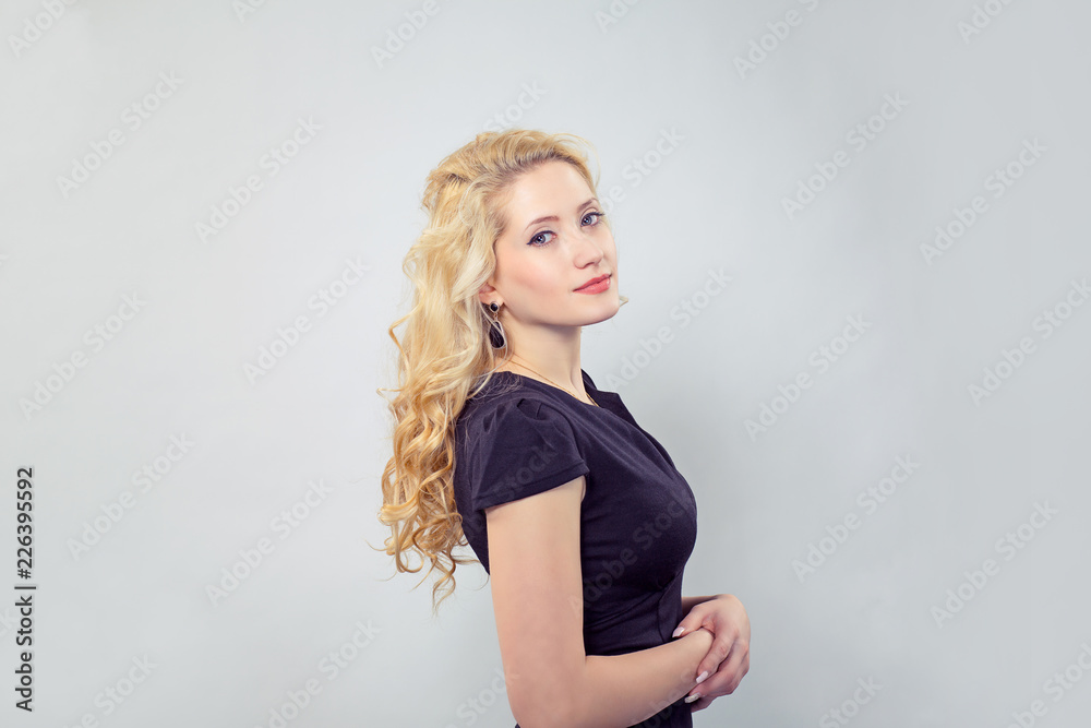 Fototapeta premium Elegant young woman in black dress