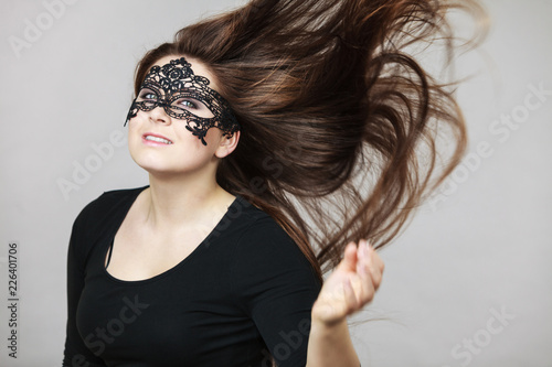 Mysterious woman wearing lace mask