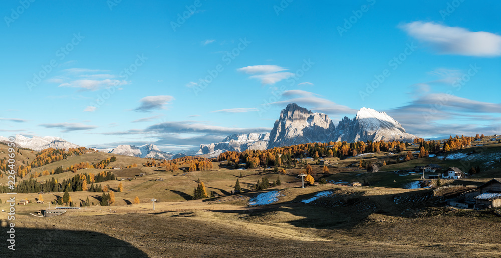 Alpe di Siusi - Seiser Alm with Sassolungo - Langkofel mountain group panorama in background at sunset