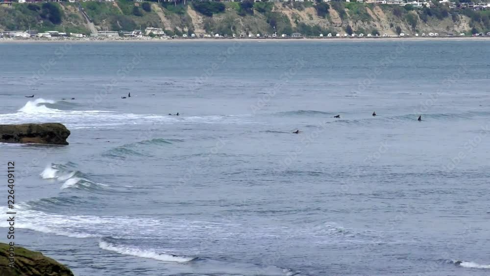 Unidentified surfers at Santa Cruz, Pleasure Point, on the northern Monterey Bay in Santa Cruz County, California, USA, a world renowned surf location Unidentified surfers at Santa Cruz, Pleasure Point, on the northern Monterey Bay in Santa Cruz County, California, USA, a world renowned surf location