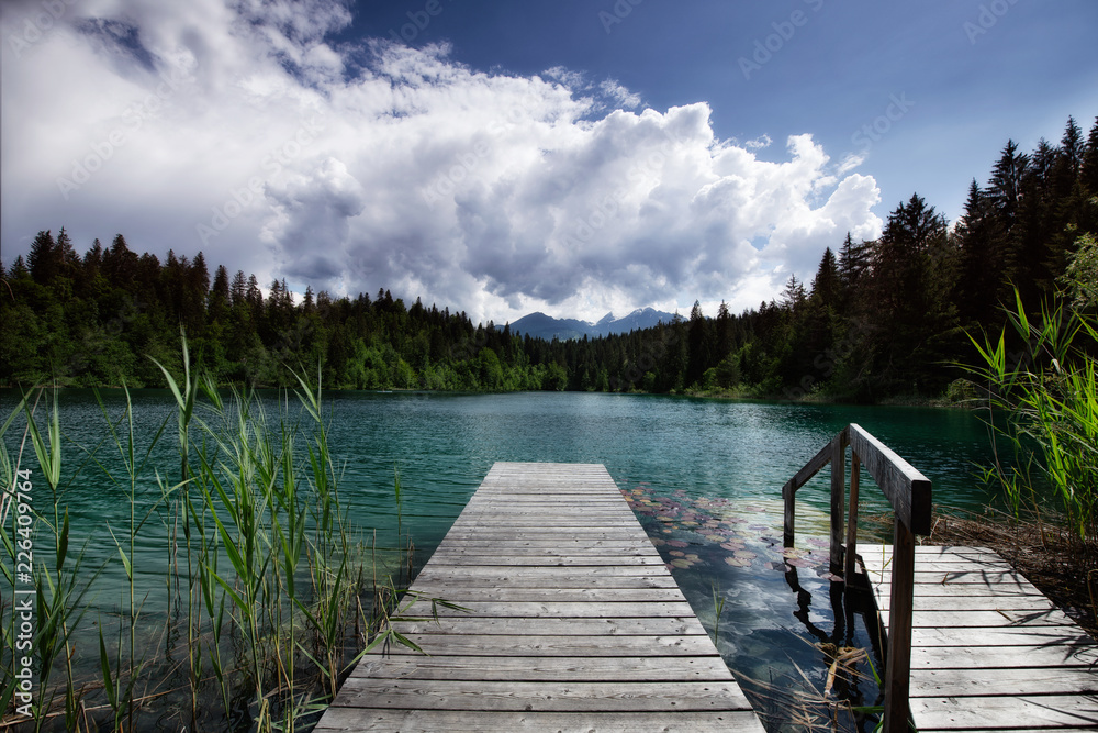 landing stage at a lake in the mountains