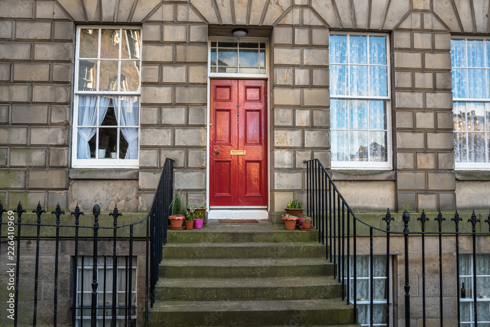 Fototapeta premium Red Wooden Front Door of an Historic Terraced Building