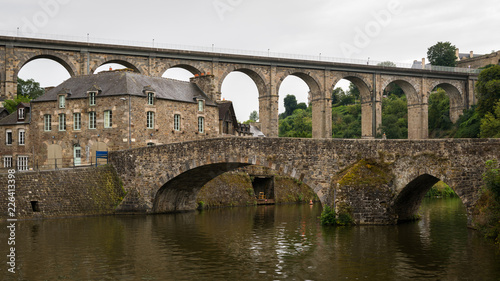 Old stone bridges in Dinan on a cloudy day in summer