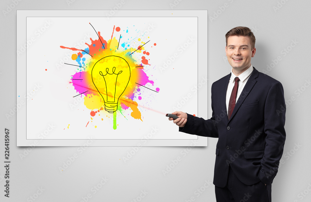 Fototapeta premium Man with laser pointer presenting innovative idea 