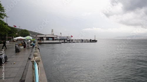Slow motion Ferry Port of Heybeli Island in an overcast cloudy day photo