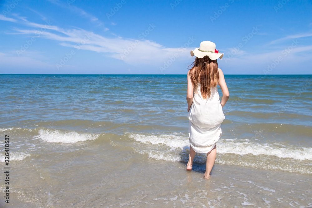 Portrait of beautiful young asian woman summer vacation on beach,Cute teenage girl at sea