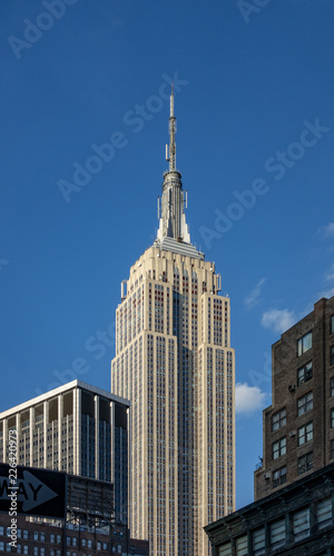 фотография blue sky day in metropolis midtown New York city building skyline