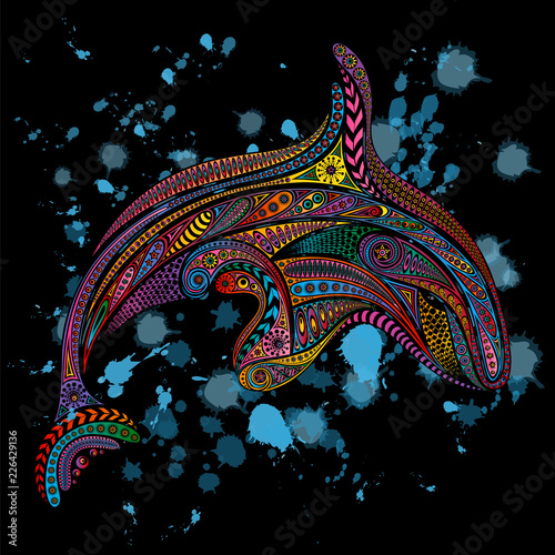 Vector killer whale from patterns on a black background with water drops