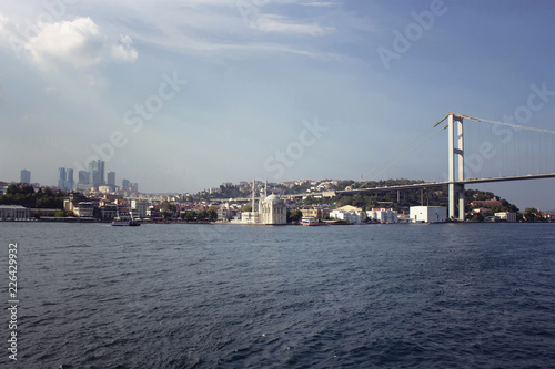View of old  historical Ortakoy Mosque by Bosphorus  the bridge and European side of Istanbul.