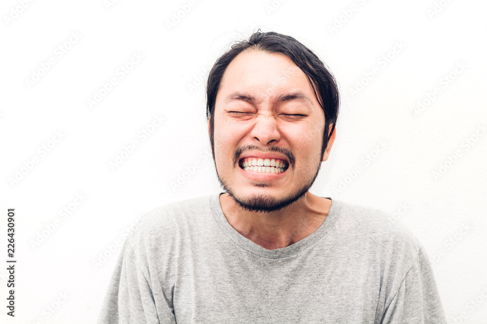 Obraz premium Portrait of happy smiling asian young handsome man on white background