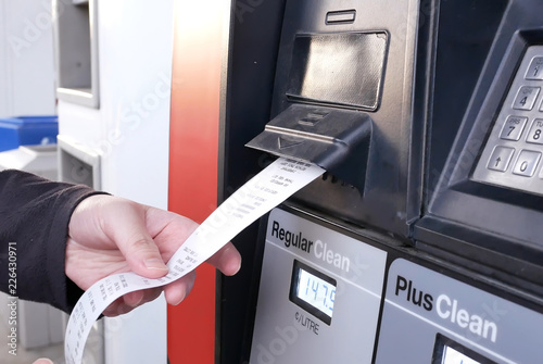 Fotografía Motion of woman taking receipt at Petro Canada gas station
