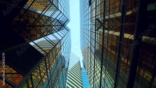modern skyscrapers in business district against blue sky. Futuristic modern architecture building. Financial economy growth concept.