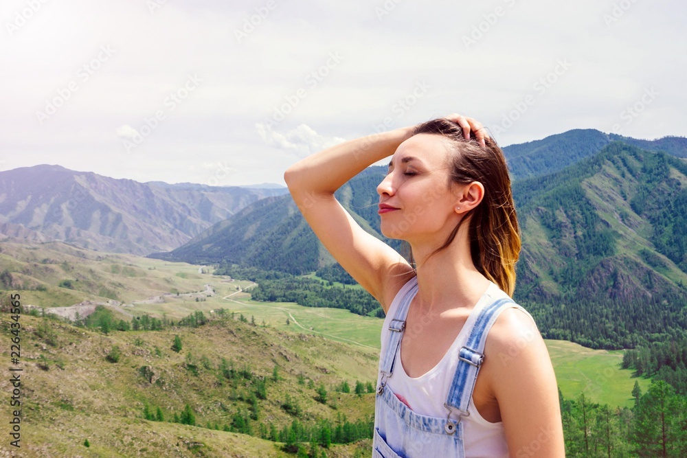 Tourist girl in the mountains
