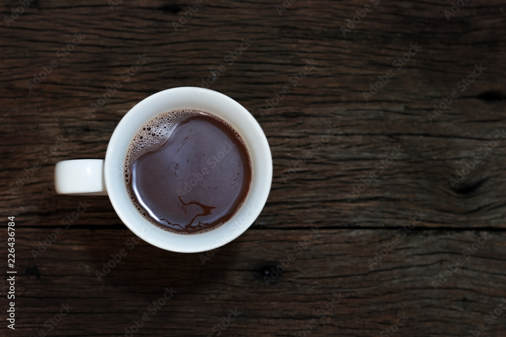 Coffee on wood background top view.