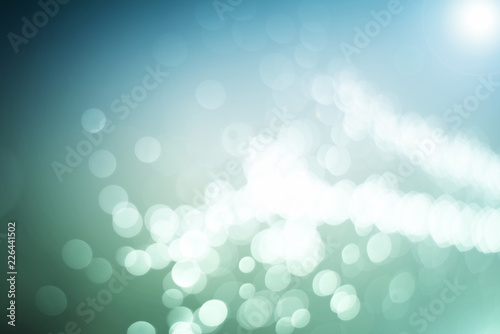Blurred abstract bokeh light of fly water background, Christmas two tone colors.