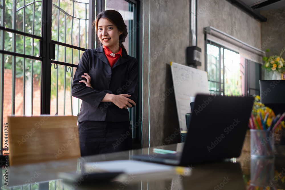 Businesswoman working with laptop in workstation. Office worker concept Businesswoman working with laptop in workstation. Office worker concept