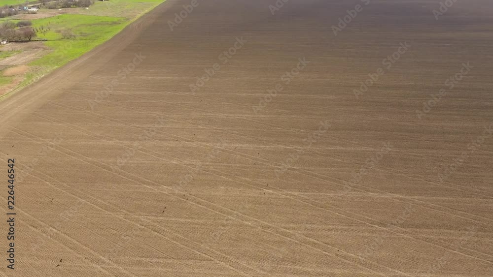 Plowed after harvesting the wheat field. Rise up above the field Plowed after harvesting the wheat field. Rise up above the field