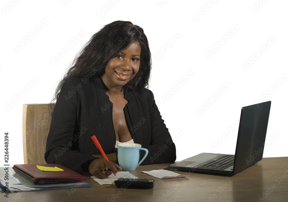 young happy and attractive black afro American business woman working at office computer desk smiling successful posing corporate as efficient and experienced CEO young happy and attractive black afro American business woman working at office computer desk smiling successful posing corporate as efficient and experienced CEO