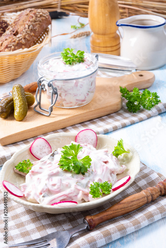 delicious homemade meat salad with mayonnaise and cucumber