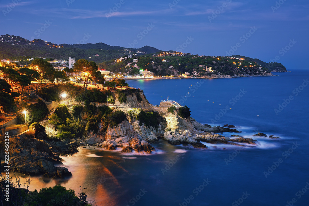 Fototapeta premium View to Balearic resort Lloret de Mar after sunset, summertime outdoor background